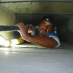 Specialist Checking Duct Interior