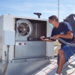 Specialist Cleaning a Commercial AC Unit