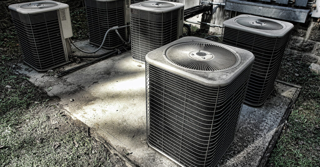 Four Old AC Units on a Pad