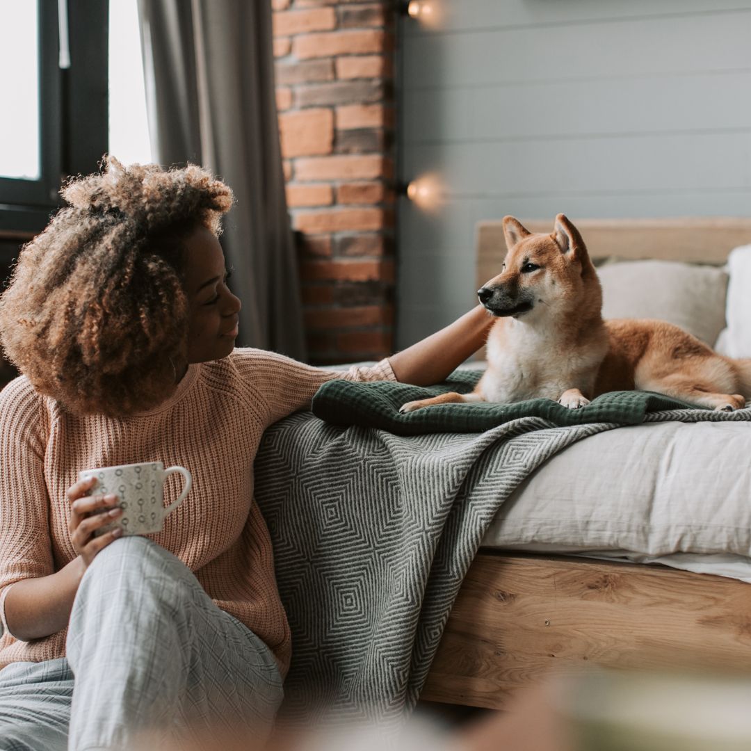 woman petting her dog